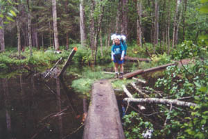 Crossing flooded sections of trail on causeways